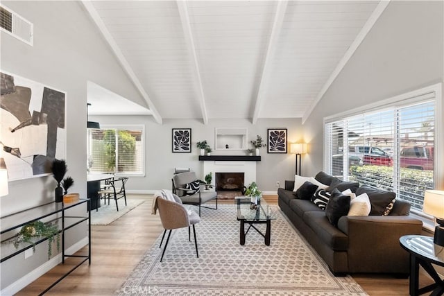 2433 Carlsbad Cir, Hemet, CA 92545 - living room featuring a fireplace with raised hearth and wood finished floors