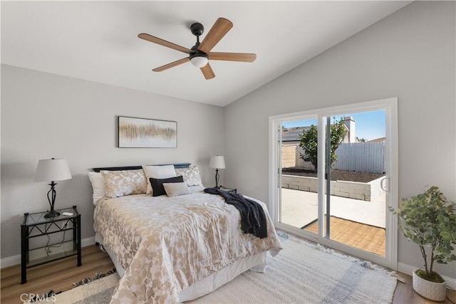 2433 Carlsbad Cir, Hemet, CA 92545 - bedroom featuring access to exterior, lofted ceiling, wood finished floors, and ceiling fan