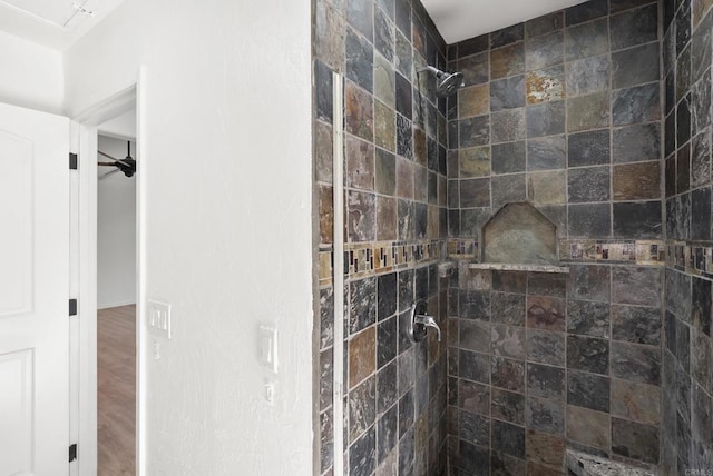 12405 Royal Rd, El Cajon, CA 92021 - bathroom featuring a tile shower and wood finished floors