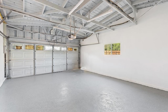 12405 Royal Rd, El Cajon, CA 92021 - garage featuring a garage door opener and baseboards