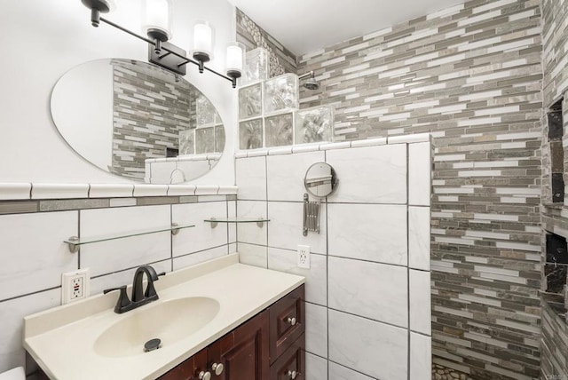 12405 Royal Rd, El Cajon, CA 92021 - bathroom featuring tile walls, a walk in shower, vanity, and decorative backsplash