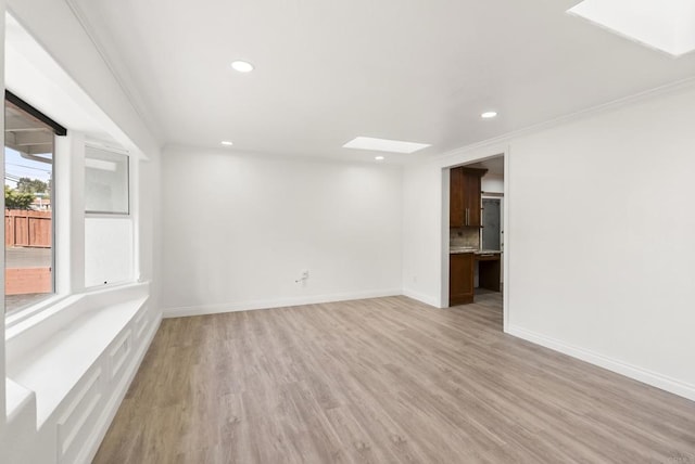 12405 Royal Rd, El Cajon, CA 92021 - empty room featuring a skylight, light wood-style flooring, and recessed lighting