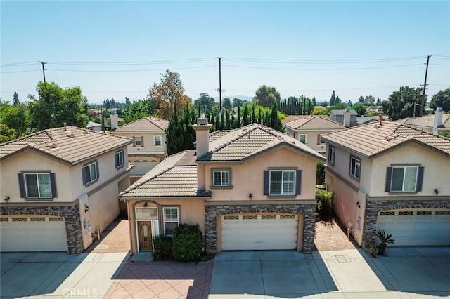 5517 Welland Ave Unit B, Temple City, CA 91780 - view of front of house featuring stucco siding, a garage, stone siding, driveway, and a tile roof