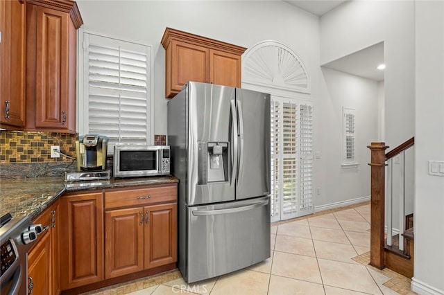 5517 Welland Ave Unit B, Temple City, CA 91780 - kitchen with appliances with stainless steel finishes, decorative backsplash, and brown cabinets