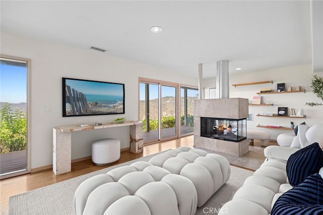 1324 Pitcairn Pl, Laguna Beach, CA 92651 - living room with wood finished floors, a multi sided fireplace, and recessed lighting
