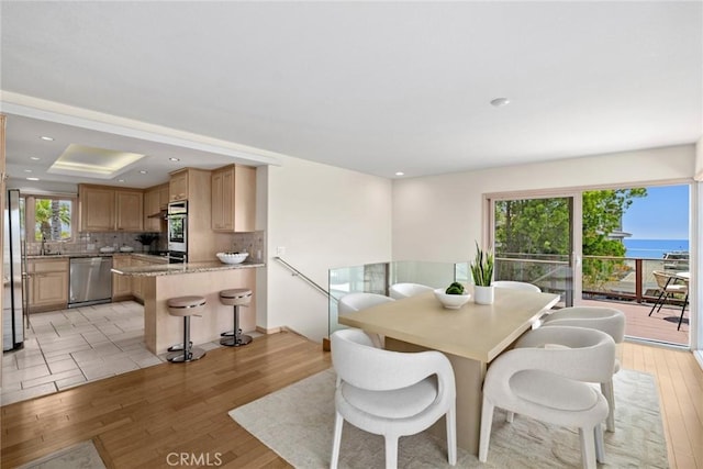 1324 Pitcairn Pl, Laguna Beach, CA 92651 - dining space with light wood-type flooring, recessed lighting, and a raised ceiling