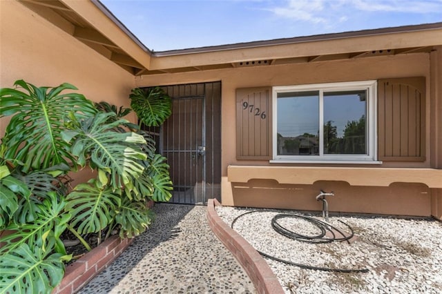 9726 Kimberly Ave, Montclair, CA 91763 - entrance to property with stucco siding and a gate