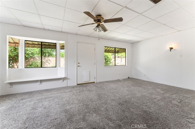 9726 Kimberly Ave, Montclair, CA 91763 - unfurnished living room featuring carpet flooring, a drop ceiling, and a ceiling fan