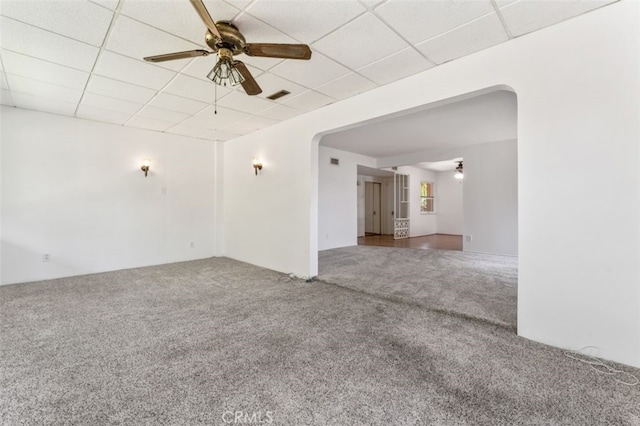 9726 Kimberly Ave, Montclair, CA 91763 - unfurnished room featuring carpet flooring, ceiling fan, a paneled ceiling, and arched walkways