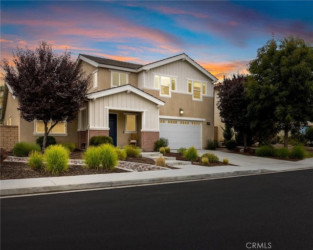 30644 Stage Coach Rd, Menifee, CA 92584 - view of front of property with brick siding, a garage, driveway, and board and batten siding