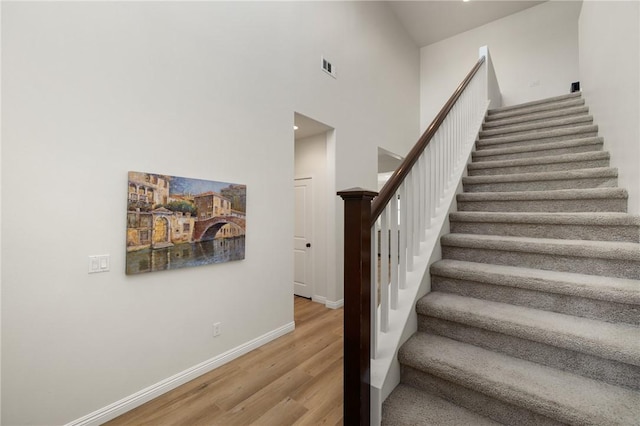 30644 Stage Coach Rd, Menifee, CA 92584 - stairway with wood finished floors and a towering ceiling