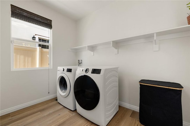 30644 Stage Coach Rd, Menifee, CA 92584 - laundry room featuring washing machine and clothes dryer and light wood-type flooring