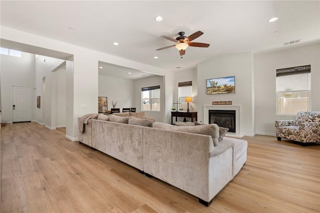 30644 Stage Coach Rd, Menifee, CA 92584 - living room with a ceiling fan, light wood-style floors, recessed lighting, and a fireplace with raised hearth