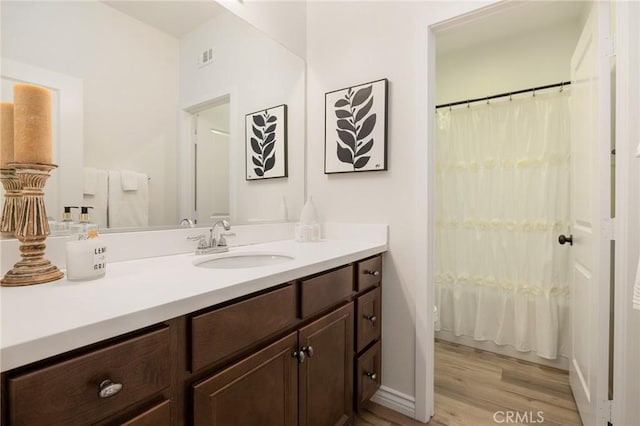 30644 Stage Coach Rd, Menifee, CA 92584 - bathroom featuring vanity, wood finished floors, and a shower with curtain