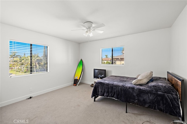 4292 Howard Ave, Los Alamitos, CA 90720 - carpeted bedroom featuring multiple windows and a ceiling fan