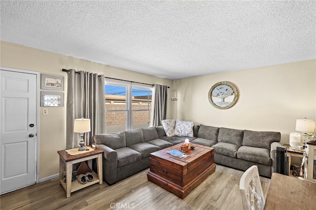 4292 Howard Ave, Los Alamitos, CA 90720 - living area featuring wood finished floors and a textured ceiling