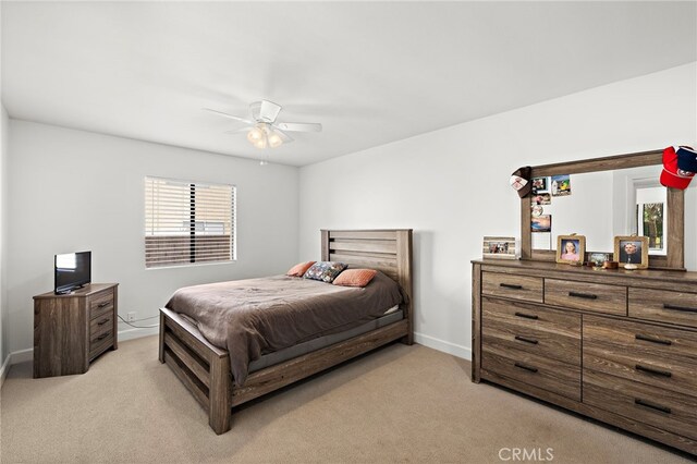 4292 Howard Ave, Los Alamitos, CA 90720 - bedroom featuring light colored carpet, multiple windows, and a ceiling fan