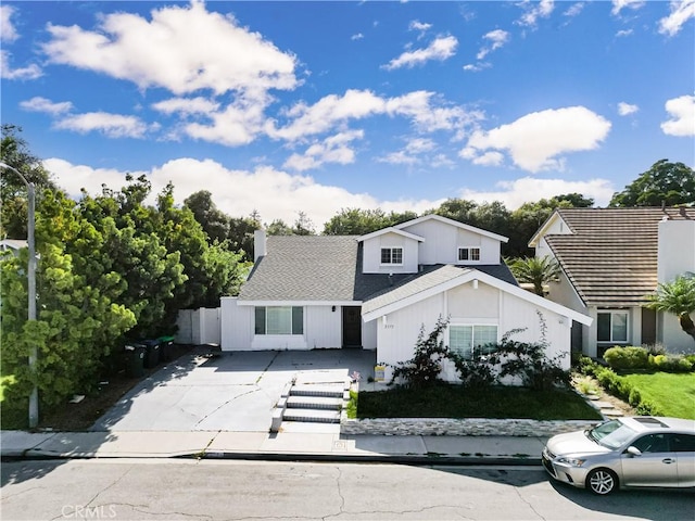 3375 Fuchsia, Costa Mesa, CA 92626 - view of front of house with concrete driveway and a chimney