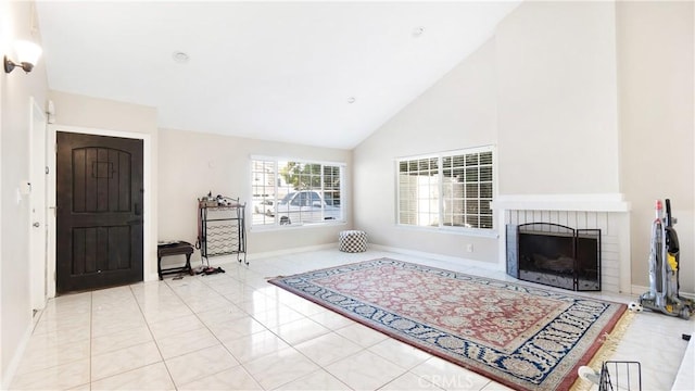 3375 Fuchsia, Costa Mesa, CA 92626 - living area with a fireplace, high vaulted ceiling, and light tile patterned floors