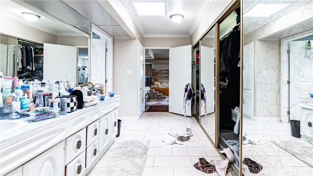 3375 Fuchsia, Costa Mesa, CA 92626 - bathroom with double vanity, a spacious closet, and crown molding