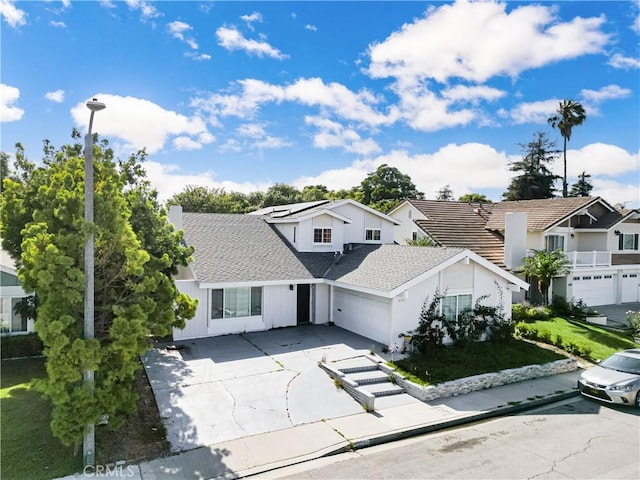 3375 Fuchsia, Costa Mesa, CA 92626 - view of front of property featuring concrete driveway, a garage, a shingled roof, and a residential view