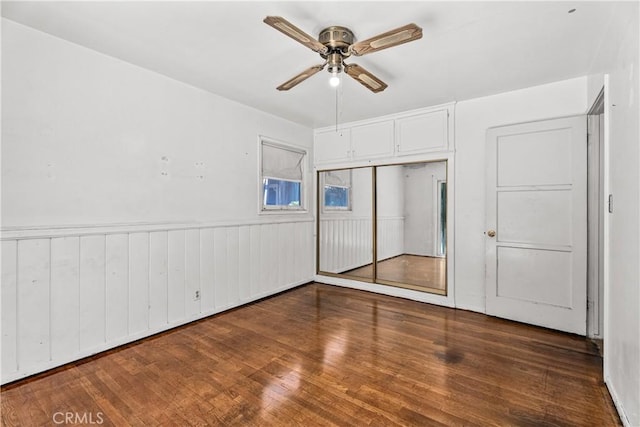 1920 Faust Ave, Long Beach, CA 90815 - unfurnished bedroom featuring a closet, wood finished floors, wainscoting, and ceiling fan