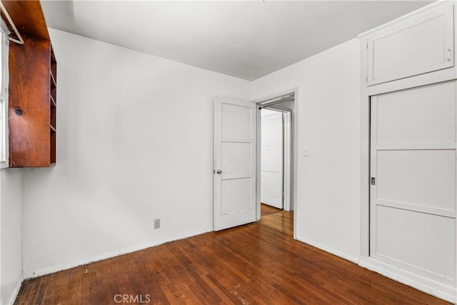1920 Faust Ave, Long Beach, CA 90815 - unfurnished bedroom featuring dark wood-type flooring and a closet