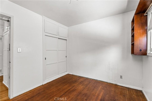 1920 Faust Ave, Long Beach, CA 90815 - unfurnished bedroom featuring dark wood finished floors and a closet