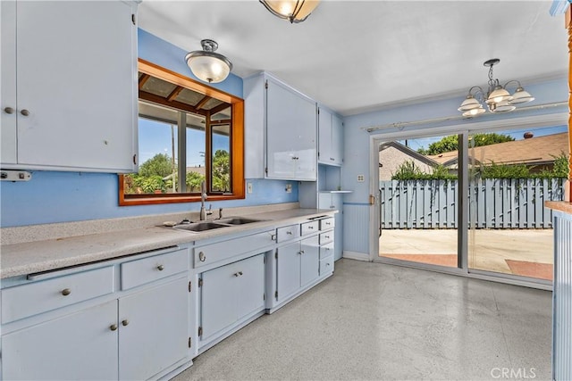 1920 Faust Ave, Long Beach, CA 90815 - kitchen with light countertops, a chandelier, and hanging light fixtures