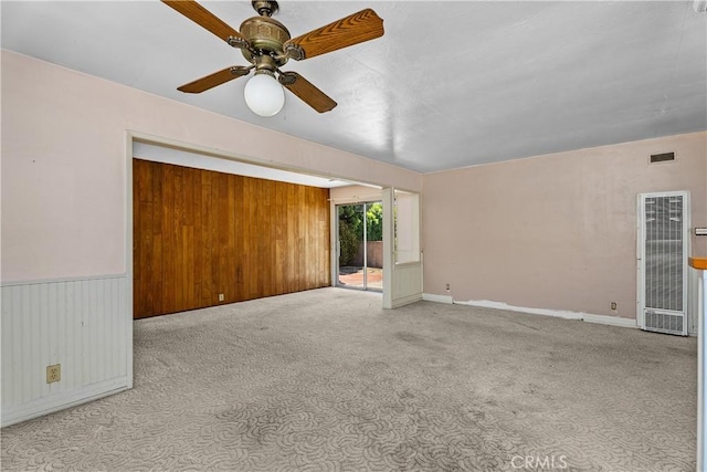 1920 Faust Ave, Long Beach, CA 90815 - unfurnished room with a heating unit, ceiling fan, carpet floors, and wooden walls