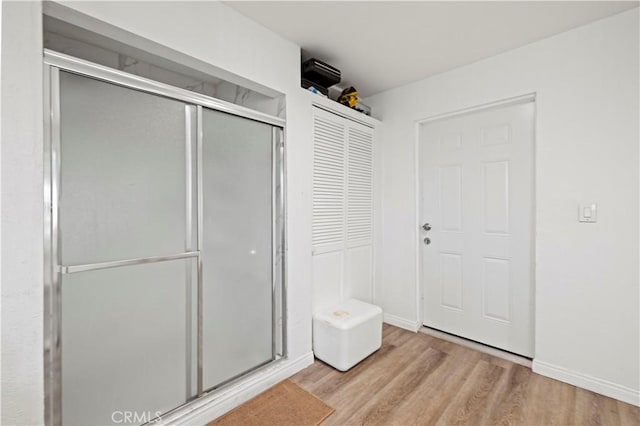 12616 Terra Bella St, Pacoima, CA 91331 - bathroom featuring wood finished floors and a stall shower