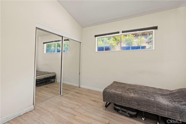 12616 Terra Bella St, Pacoima, CA 91331 - bedroom with vaulted ceiling, light wood-style flooring, and a closet