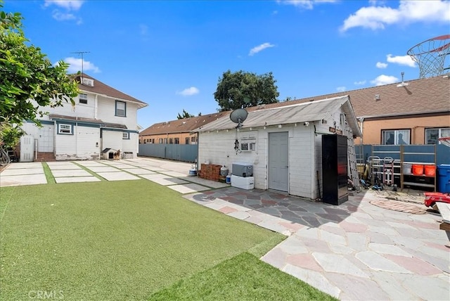 1665 Arlington Ave, Los Angeles, CA 90019 - back of property with a patio area and a storage shed
