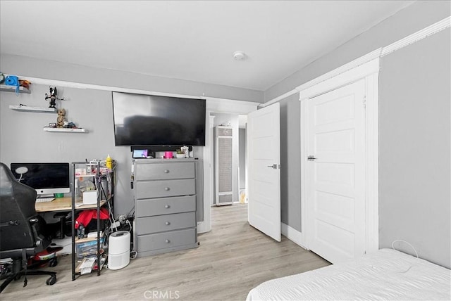 1665 Arlington Ave, Los Angeles, CA 90019 - bedroom with wood finished floors and an office area