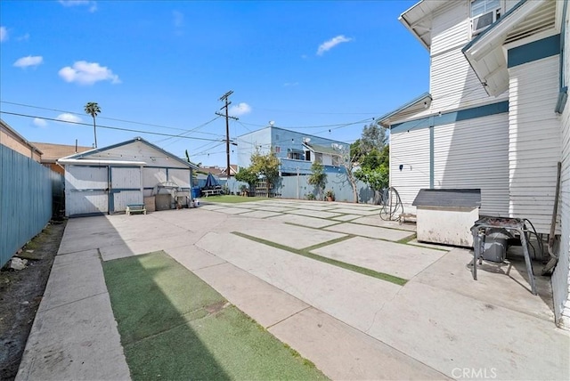 1665 Arlington Ave, Los Angeles, CA 90019 - fenced backyard with a patio and a residential view