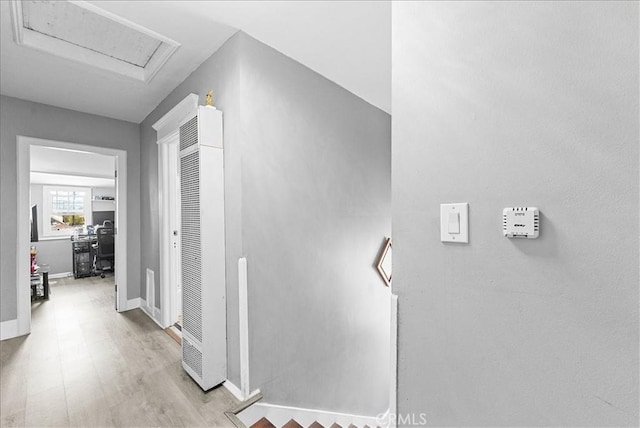 1665 Arlington Ave, Los Angeles, CA 90019 - hall featuring an office area, light wood-style flooring, and a heating unit