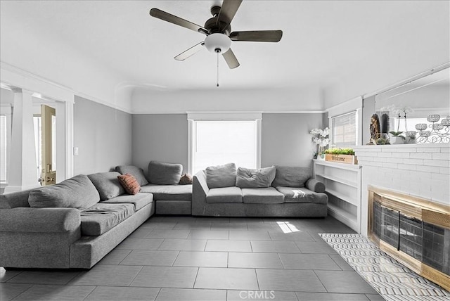 1665 Arlington Ave, Los Angeles, CA 90019 - living area featuring a brick fireplace, ceiling fan, and tile patterned floors