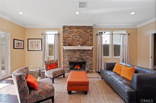 533 Roswell Ave, Long Beach, CA 90814 - living room featuring ornamental molding, a fireplace, recessed lighting, and light wood-style flooring
