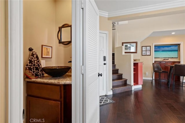 533 Roswell Ave, Long Beach, CA 90814 - corridor with dark wood finished floors, stairs, and ornamental molding