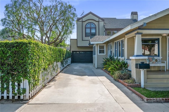 533 Roswell Ave, Long Beach, CA 90814 - view of front facade with driveway, a garage, roof with shingles, and a chimney
