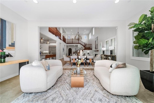 53 Interlude, Irvine, CA 92620 - living area featuring recessed lighting, a chandelier, stairs, and ornamental molding