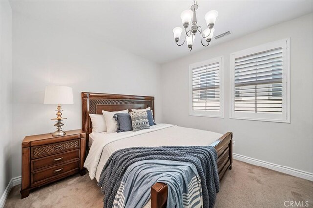 53 Interlude, Irvine, CA 92620 - bedroom featuring light carpet and a chandelier