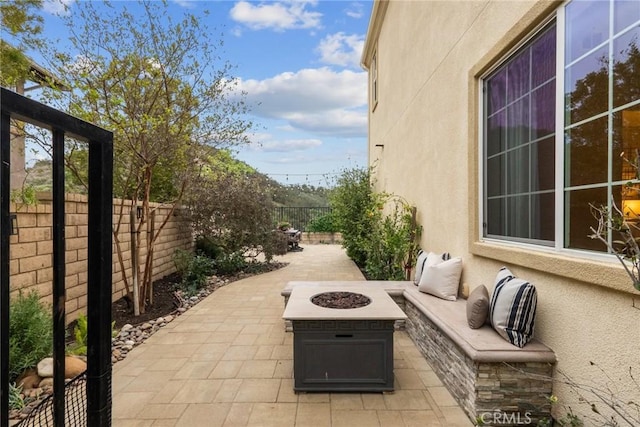 24912 Hearth Ct, Valencia, CA 91354 - fenced backyard featuring an outdoor fire pit and a patio area