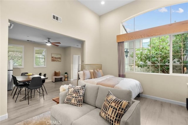 24912 Hearth Ct, Valencia, CA 91354 - bedroom featuring wood finished floors, a high ceiling, and recessed lighting
