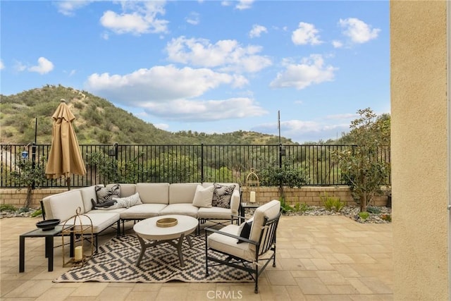 24912 Hearth Ct, Valencia, CA 91354 - fenced backyard featuring an outdoor hangout area, a patio area, and a mountain view