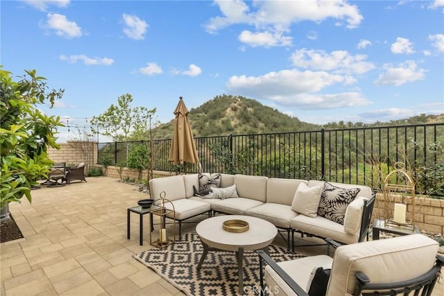 24912 Hearth Ct, Valencia, CA 91354 - fenced backyard with an outdoor living space, a patio area, and a mountain view