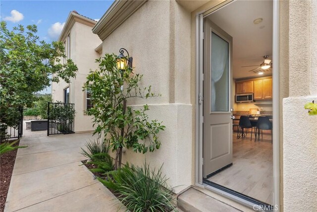 24912 Hearth Ct, Valencia, CA 91354 - property entrance with stucco siding and a gate
