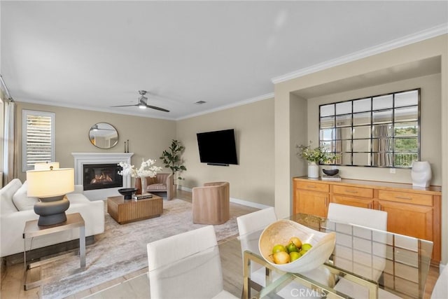 24912 Hearth Ct, Valencia, CA 91354 - living room with crown molding, a ceiling fan, and a glass covered fireplace