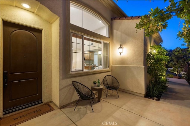 24912 Hearth Ct, Valencia, CA 91354 - doorway to property featuring stucco siding and a patio area