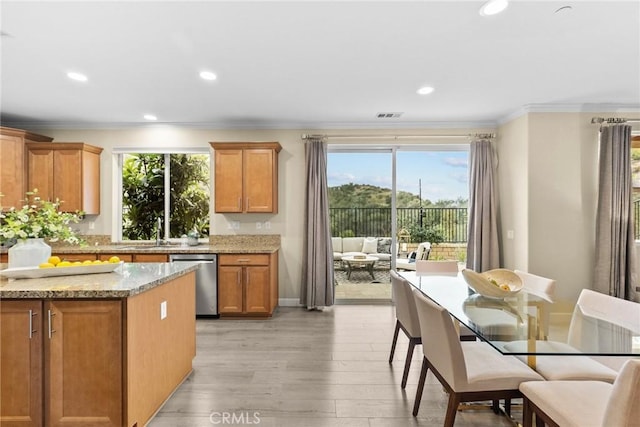 24912 Hearth Ct, Valencia, CA 91354 - kitchen featuring dishwasher, plenty of natural light, light wood finished floors, ornamental molding, and recessed lighting